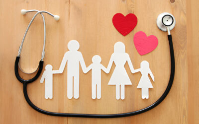 A stethoscope alongside a family cutout, symbolizing care and love, with hearts representing connection and health.